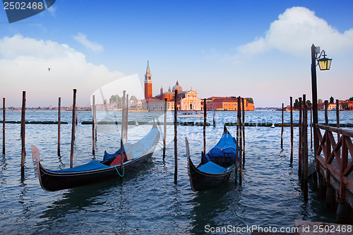 Image of Gondolas and San Giorgio Maggiore church on Grand Canal in Venic