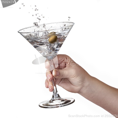 Image of Splash of martini in womans hand isolated