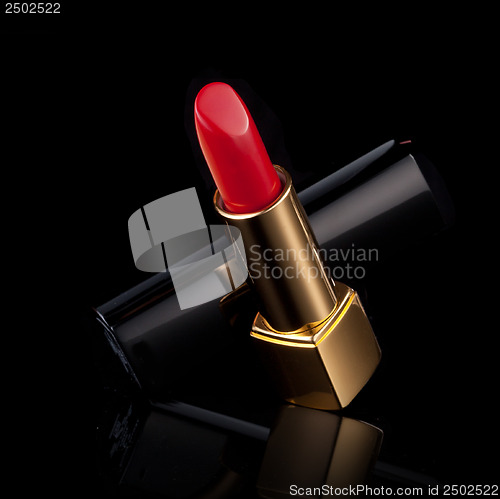 Image of red lipstick isolated on black