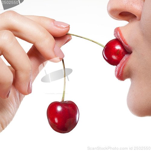 Image of Young woman with cherry isolated on white