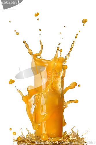 Image of orange juice splash in the glass isolated on white