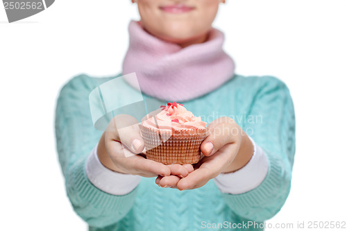 Image of Woman holding a pink cupcake on white