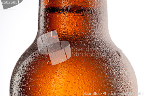 Image of Beer bottle with water drops and frost isolated on white