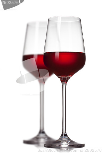 Image of Two red wine glasses isolated on white