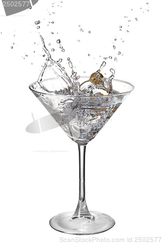 Image of Martini with splash and olive isolated on white