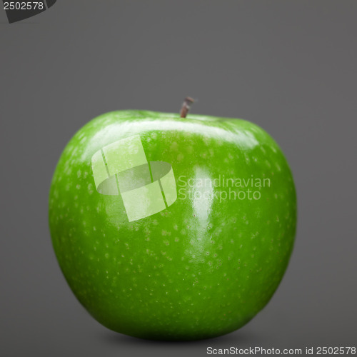 Image of green apple isolated on grey