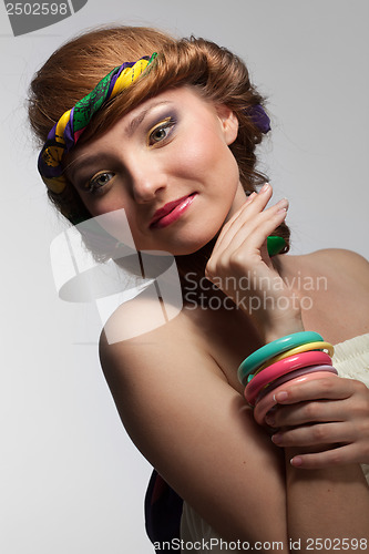 Image of portrait of smiling beautiful young woman on white