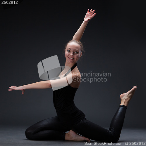 Image of attractive young woman dancing