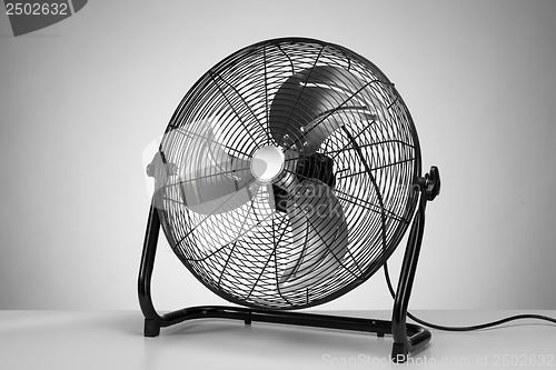 Image of black  modern electric fan on white