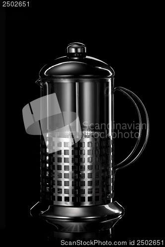 Image of stainless steel teapot isolated on black