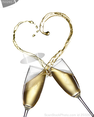 Image of Champagne splash in shape of heart isolated on white