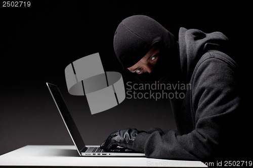 Image of Computer hacker in a balaclava