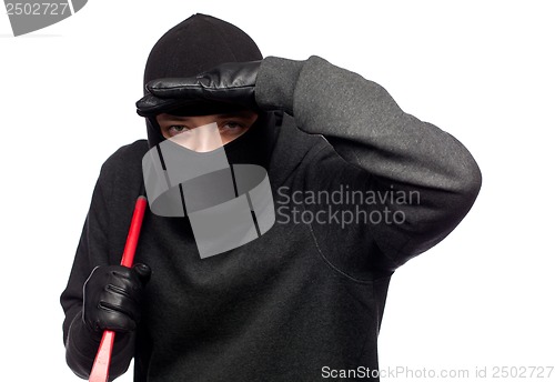 Image of Burglar with a crowbar on the shoulder.