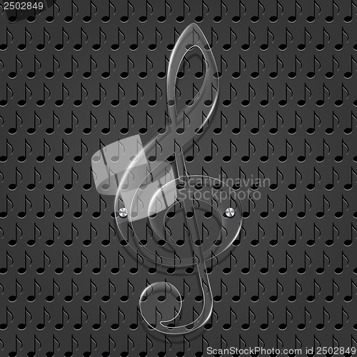 Image of Glass treble clef on metal texture background.