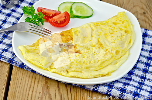 Image of Omelette with vegetables on the board