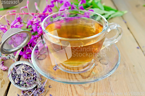 Image of Herbal tea from fireweed in a glass cup with strainer