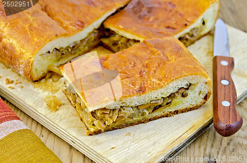 Image of Pie with cabbage and chanterelles on the board