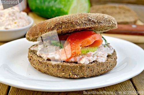 Image of Sandwich with cream and salmon on the board