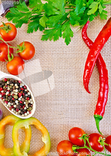 Image of Frame of vegetables and spices on burlap