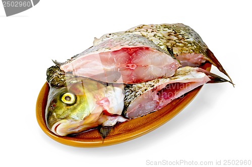 Image of Bream raw in a clay plate