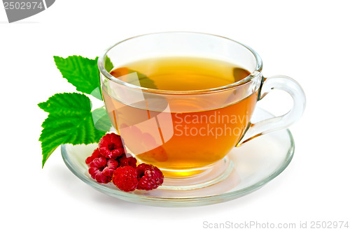 Image of Tea with raspberries in a cup