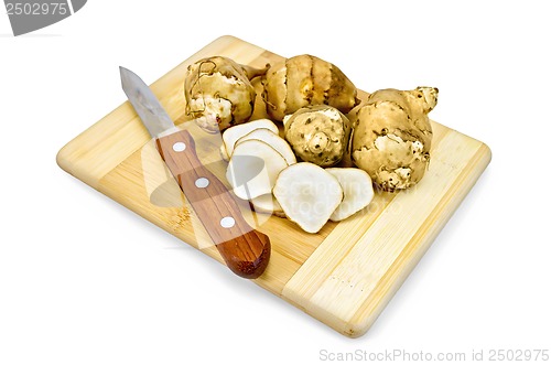 Image of Jerusalem artichoke with a knife