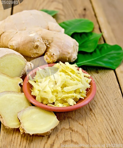 Image of Ginger fresh grated in a bowl with the root