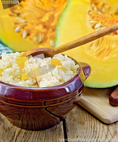 Image of Porridge millet with pumpkin and spoon