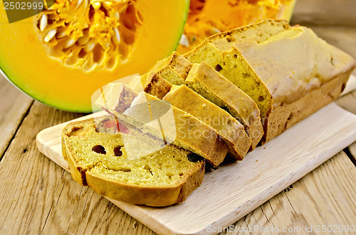 Image of Fruitcake pumpkin with candied fruits on a board