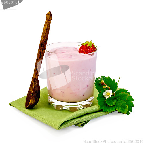 Image of Milkshake with strawberries and spoon on a napkin