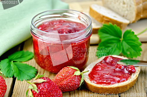 Image of Jam strawberry with bread on the board