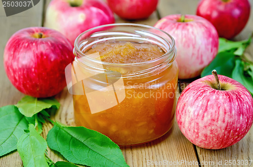 Image of Jam apple with apples and leaves on the board