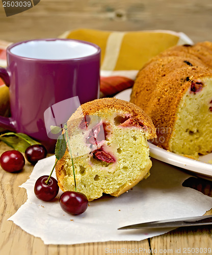 Image of Cake with berries cherries and mug on the board