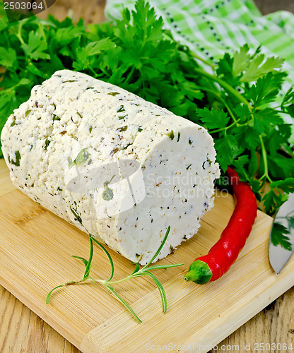 Image of Cheese homemade with spices and pepper on the board