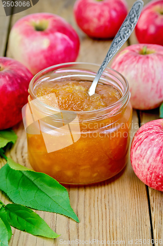Image of Jam apple with apples and spoon on the board