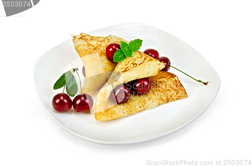 Image of Pancakes with cherries on a plate