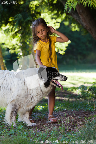 Image of Little girl with dog