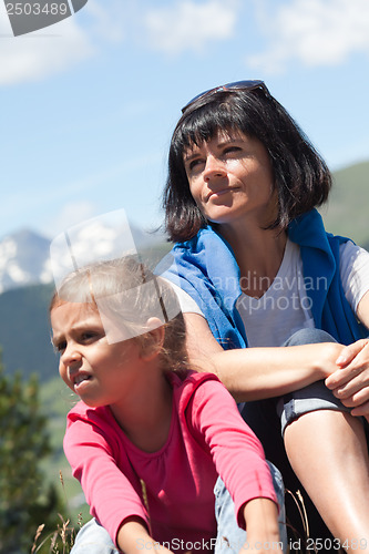 Image of Mother with her daughter relaxing in the mountain