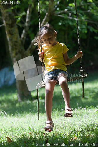 Image of Little girl on seesaw