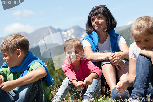 Image of Family relaxing in the mountain