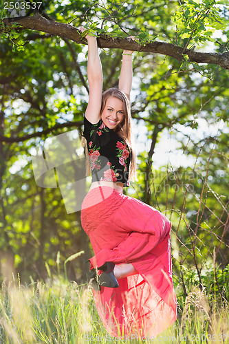 Image of Smiling young blond woman