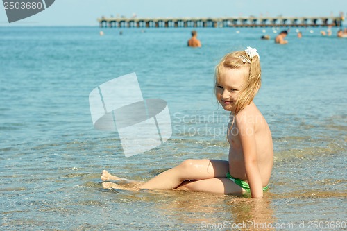 Image of Little girl on the coastal seawater