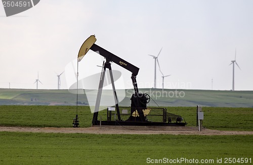 Image of Pump Jack and wind farm