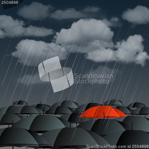 Image of Red umbrella over many dark ones