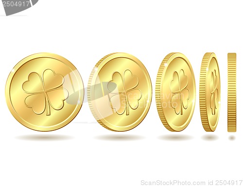 Image of Set of golden coins with four leaf clover.