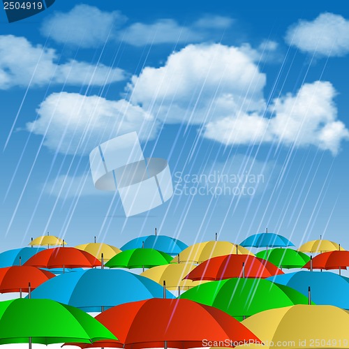 Image of Colorful umbrellas in rain.