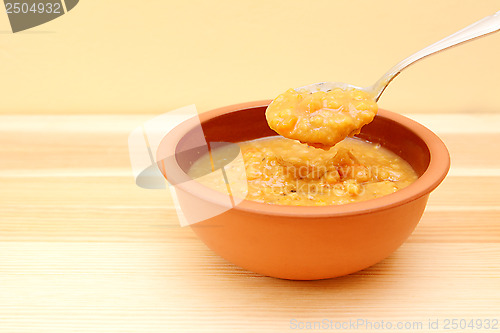 Image of Closeup of spoonful of hearty lentil and vegetable soup 