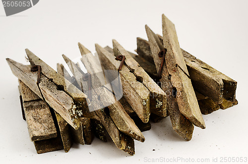 Image of dirty old wooden clothespins 
