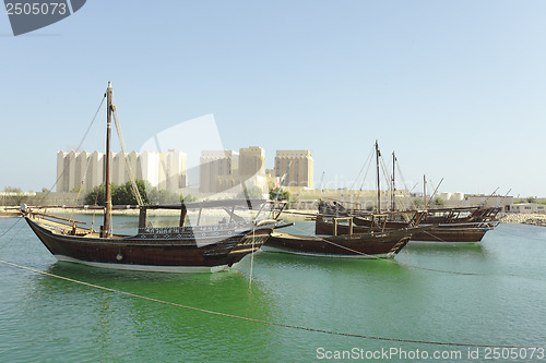 Image of Dhows and Doha Port buildings,