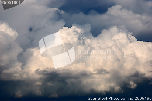 Image of cumulus clouds illuminated by the sun 